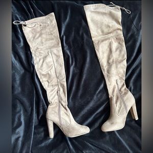 Beige thigh high heeled boots